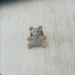 Swarovski crystal teddy bear pin with green rhinestone eyes